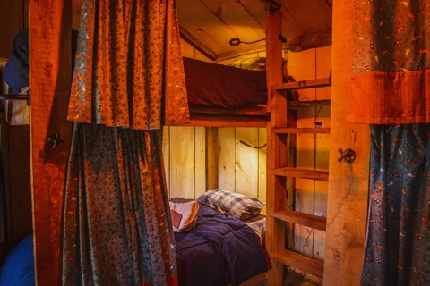 Bunks made up inside the heated bunkhouse